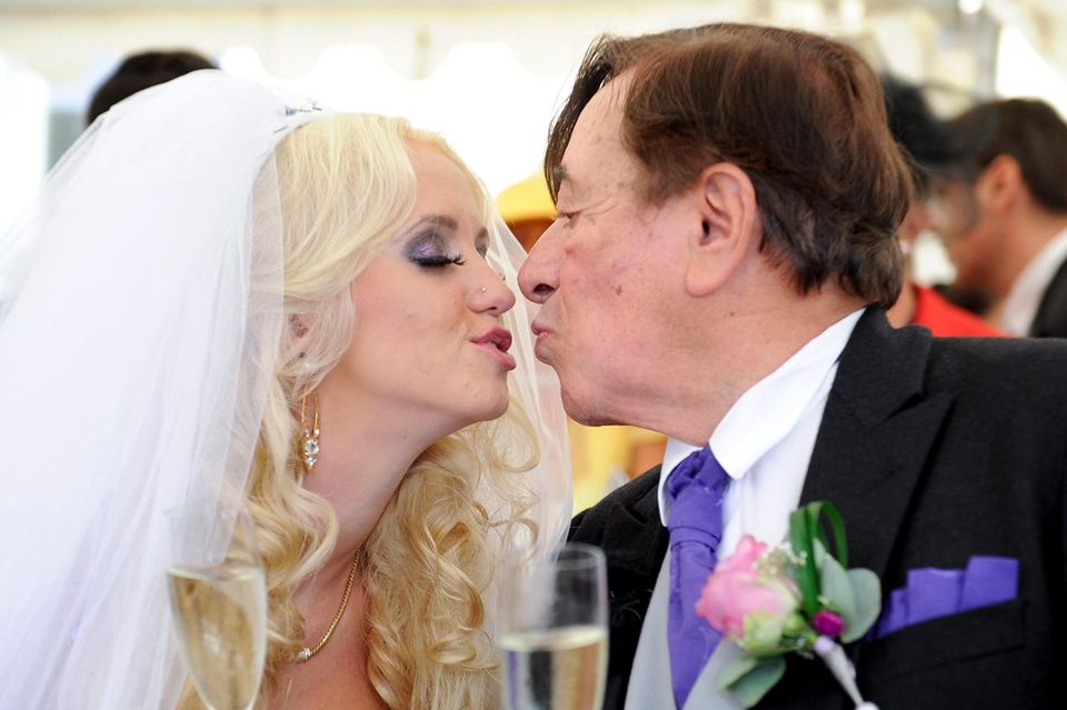 epa04398615 Austrian entrepreneur Richard Lugner (R) and Cathy Schmitz (L) pose for photographs during their wedding ceremony a…