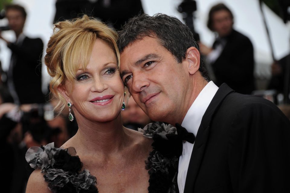 Spanish actor Antonio Banderas and his wife, US actress Melanie Griffith, pose on the red carpet before the opening ceremony an…