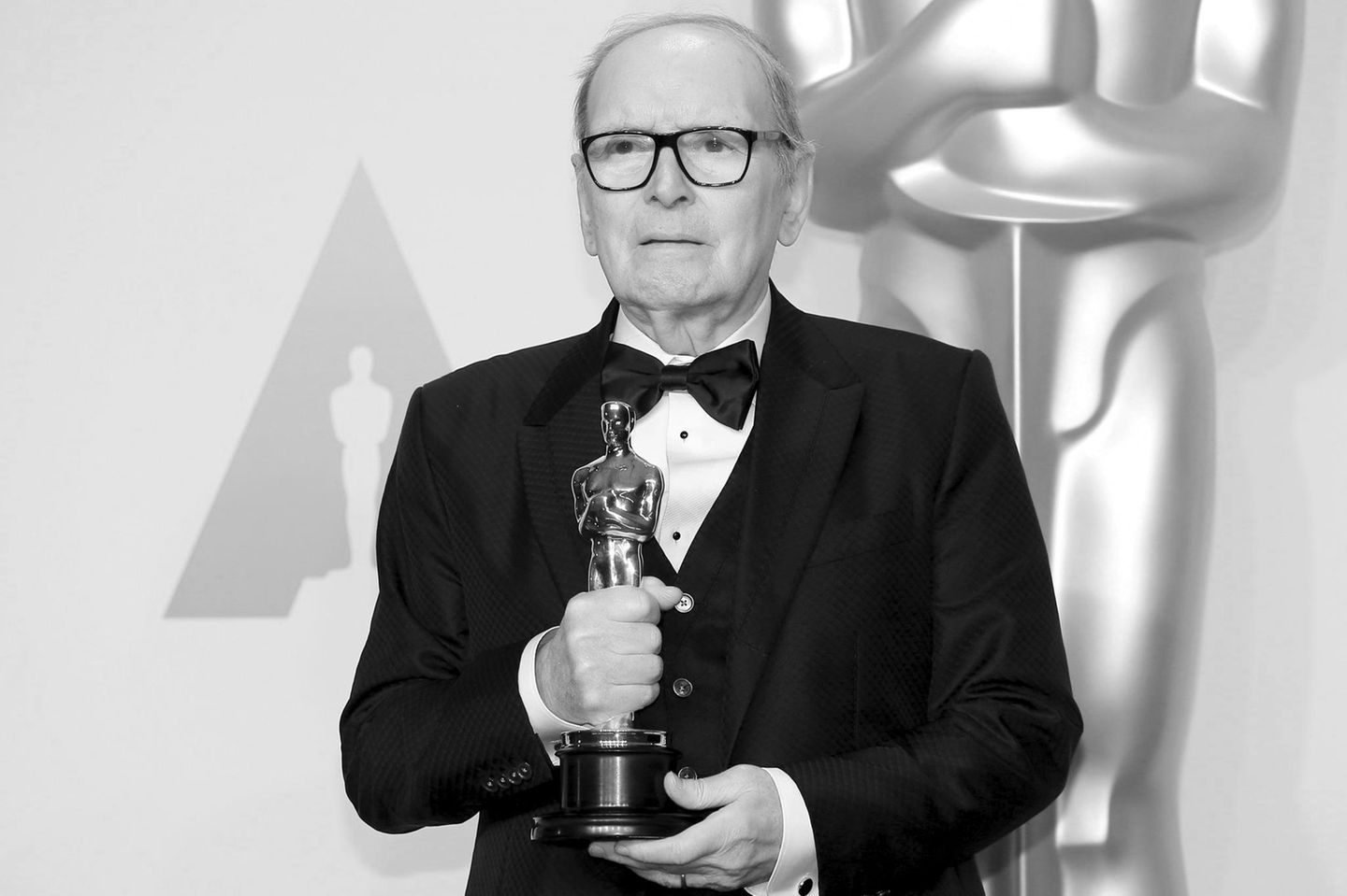 FILE PHOTO: Italian composer Ennio Morricone poses with his Oscar for Best Original Score for "The Hateful Eight," during the 8…