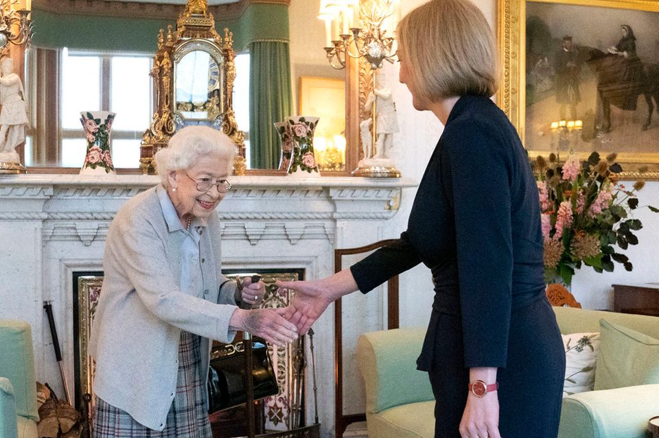 FILE - Britain's Queen Elizabeth II, left, welcomes Liz Truss during an audience at Balmoral, Scotland, where she invited the n…