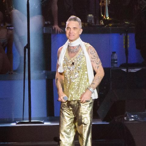 BGUK_2668085 - Newport, UNITED KINGDOM - Robbie Williams, ex Take That, headlining Isle of Wight festival in Gold Lame suit.Pic…